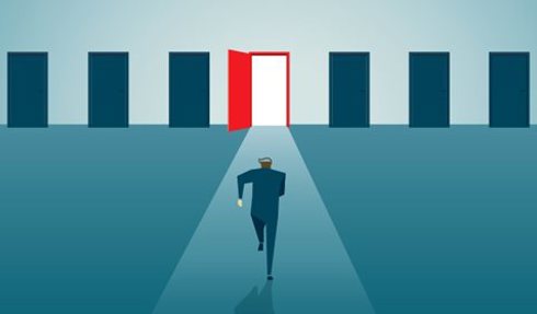 Man running toward middle door out of a series of doors