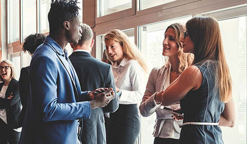 group of people socializing at fundraising event