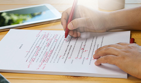 proofreader marking up document