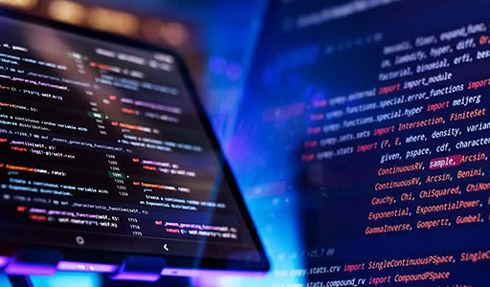 Software code on two juxtaposed monitors