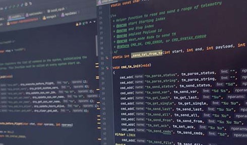 close up of code shown on two screens